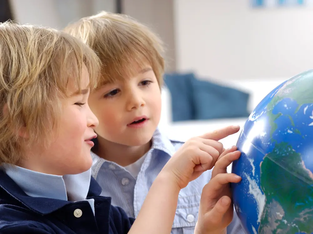 boys pointing at globe.jpg